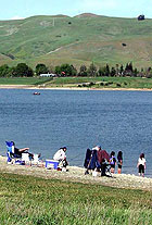 Citizens by large lake bed