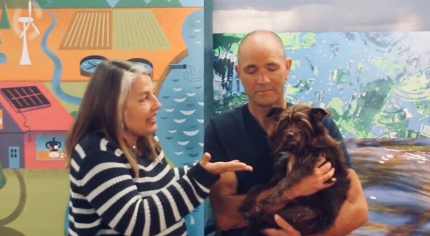 Leelee the dog with man and woman